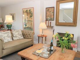 A living room with a sofa and coffee table at Fairview Cottage in Milton-Under-Wychwood