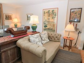 A living room with a sofa and table at Fairview Cottage in Milton-Under-Wychwood