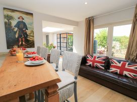 A dining room with a table set for breakfast at Fairview Cottage in Milton-Under-Wychwood