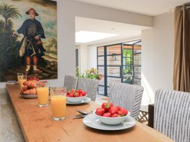 A dining room with a table set for breakfast at Fairview Cottage in Milton-Under-Wychwood