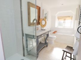 A bathroom with a shower, sink, and toilet at Fairview Cottage in Milton-Under-Wychwood