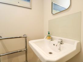 A bathroom with a hand basin and soap dispenser at Church View in Bourton-On-The-Water