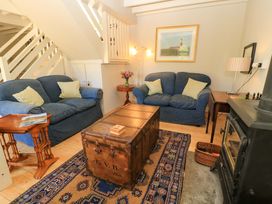 A living room with a coffee table and two sofas at Cider Press Cottage in Priston Village, Bath