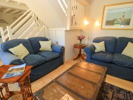 A living room with a coffee table and two sofas at Cider Press Cottage in Priston Village, Bath