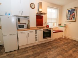 A kitchen with a refrigerator, microwave, and oven at Rojoy, Salisbury