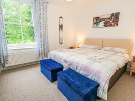 A bedroom with a bed and bedside tables at Rojoy in Salisbury
