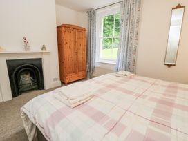 A bedroom with a bed and wardrobe at Rojoy in Salisbury