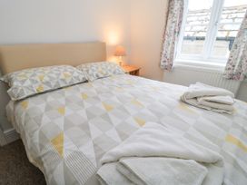 A bedroom with a double bed and a bedside lamp at Rojoy in Salisbury