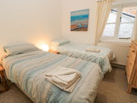 A bedroom with two beds and a painting at Rojoy in Salisbury