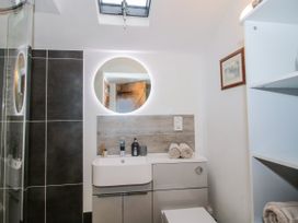 A bathroom with a shower and sink at The Shooting Folly in Cheswardine