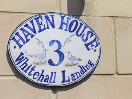 A sign reading Haven House 3 Whitehall Landing