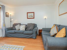 A living room with two sofas and a lamp at Haven House in Whitby
