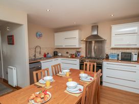 A kitchen with a dining table set for breakfast at Haven House in Whitby