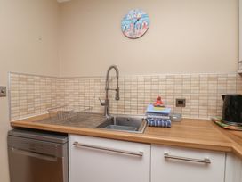 A kitchen with a sink and dishwasher at Haven House in Whitby