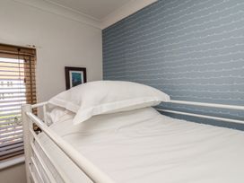 A bedroom with a bed and a window at Haven House in Whitby