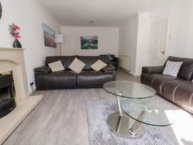 A living room with sofas and a coffee table at Talgais Llangollen