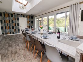 A dining room with a table set for dinner at Talgais in Llangollen