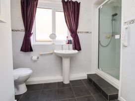 A bathroom with a sink and shower at Talgais Llangollen