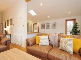 A living room with sofas and a coffee table at 6 Hedgerows in Lanreath