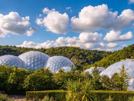 Geodesic domes surrounded by trees and shrubs at 6 Water's Edge Lanreath