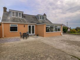 An outdoor view of a house with seating at Dalar Deg in Aberdaron