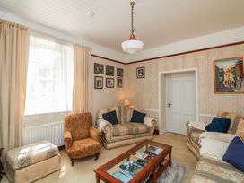 A living room with sofas and a coffee table at Cairbre House Dungarvan County Waterford