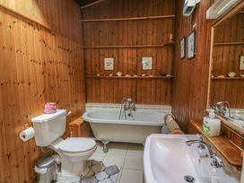 A bathroom with a bathtub, toilet, and sink at Cairbre House in Dungarvan, County Waterford