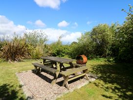 A table and benches in a garden at Cairbre House, Dungarvan, County Waterford