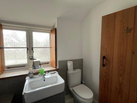 A bathroom with a sink and toilet at Ivy Cottage in West Lulworth