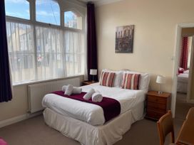 A bedroom with a double bed and window at Mutiny House Brewers Quay Harbour
