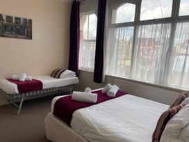 A bedroom with two beds and a window at Mutiny House Brewers Quay Harbour