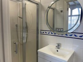 A bathroom with a shower and sink at Mutiny House Brewers Quay Harbour