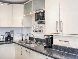 A kitchen with a sink and microwave at Estuary View in Kingsbridge
