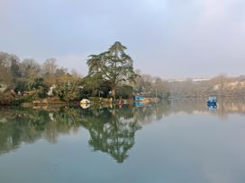 A river with boats and trees at Estuary View in Kingsbridge