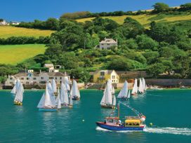 A view of sailing boats and houses near water at Estuary View in Kingsbridge