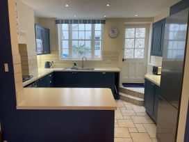 A kitchen with a sink and stove at Safe Harbour in Brewers Quay harbour