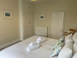 A bedroom with a bed and towels at Safe Harbour Brewers Quay harbour