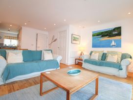 A living room with sofas and a coffee table at 16 Bolt Head in Salcombe