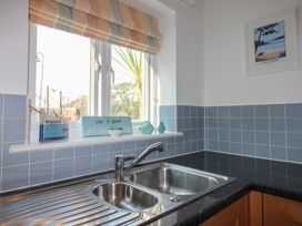 A kitchen with a sink and window at 16 Bolt Head Salcombe