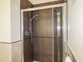 A shower with tiles in a bathroom at 16 Bolt Head in Salcombe
