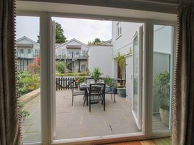 A patio area with chairs and table at 16 Bolt Head in Salcombe