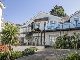 An outdoor view of a building with a staircase and balcony at 19 Bolt Head, Salcombe