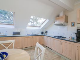 A kitchen with windows and appliances at 19 Bolt Head in Salcombe