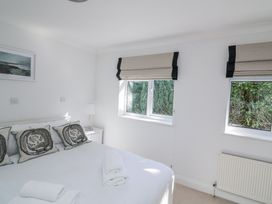 A bedroom with a bed and window at 19 Bolt Head Salcombe