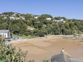 A view of the beach and trees at 19 Bolt Head in Salcombe