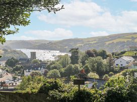 A view of a river with boats and buildings in the background at 1 Hazeldene Salcombe