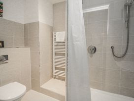 A bathroom with a shower and toilet at 1 Hazeldene Salcombe