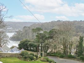 A view of trees and ocean from a property at 1 Hazeldene Salcombe