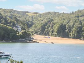 A view of a beach with houses and boats at 1 Hazeldene Salcombe