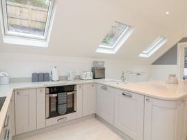 A kitchen with skylights, an oven, and appliances at 1 The Old Coach House Dartmouth